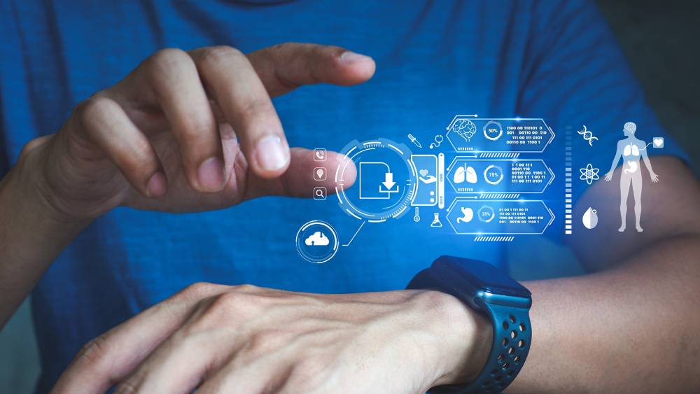 Man interacting with futuristic holographic health and technology interface via smartwatch.