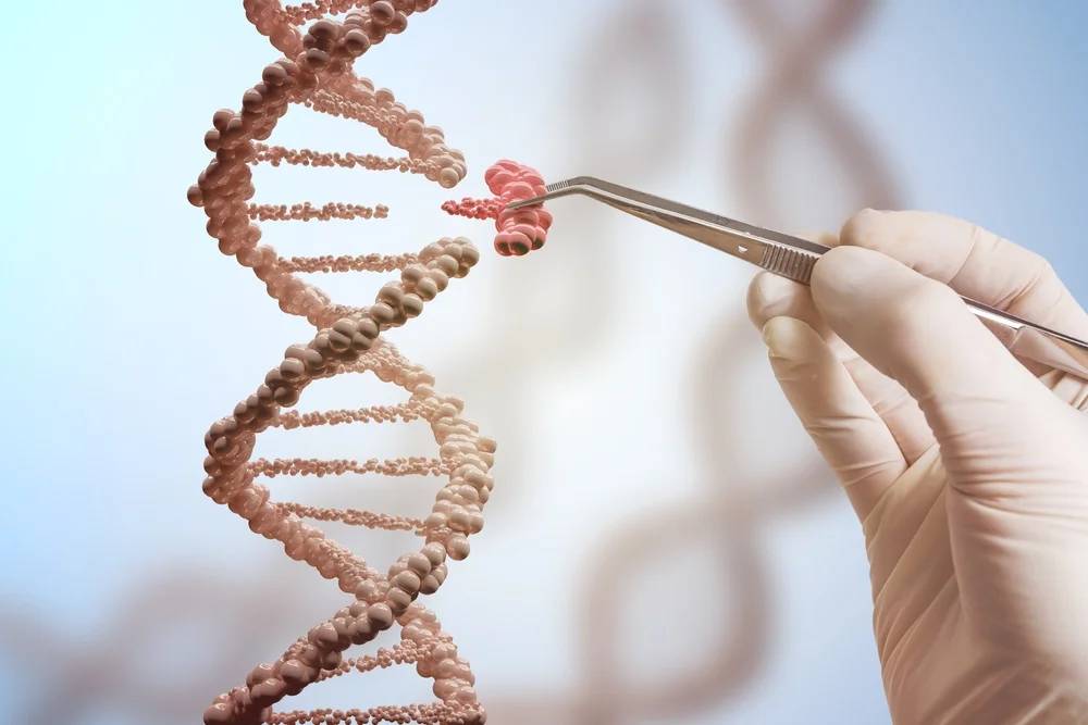 A hand in a surgical glove uses tweezers to manipulate a stylized DNA strand against a light blue background.