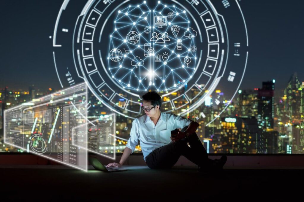 Person using a laptop with futuristic digital holograms and urban skyline background.